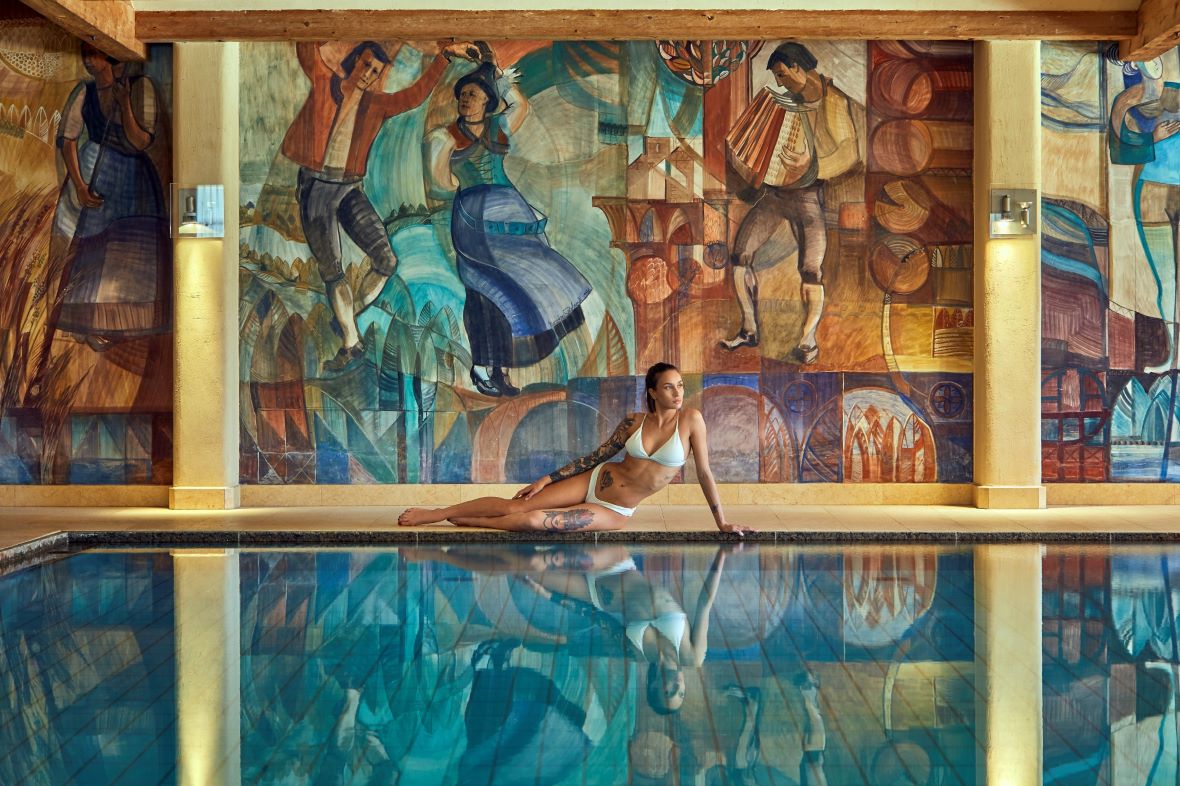 Model by indoor pool of Sporthotel Panorama